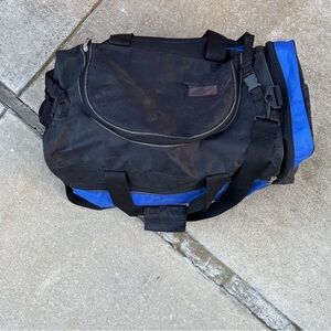 Black and Blue Duffel Bag with Taekwondo Sparring Gear